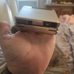Aurzen ZIP Tri-Fold DLP Truly Mini Projector. Pocket Size. Zero-Lag Focus. One-Click Screen Mirroring. Full-Screen Mode. Type-C Fast Charging. 5.000mAh Battery. Indoor Outdoor Portable Projector.Gold